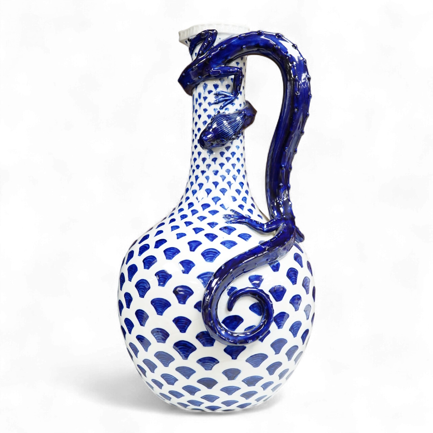 An unusual late 19th century Royal Worcester 'dragon' jug with blue scale decoration, 30cm